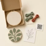 Hoop wall art kit contents with punch needle coaster materials